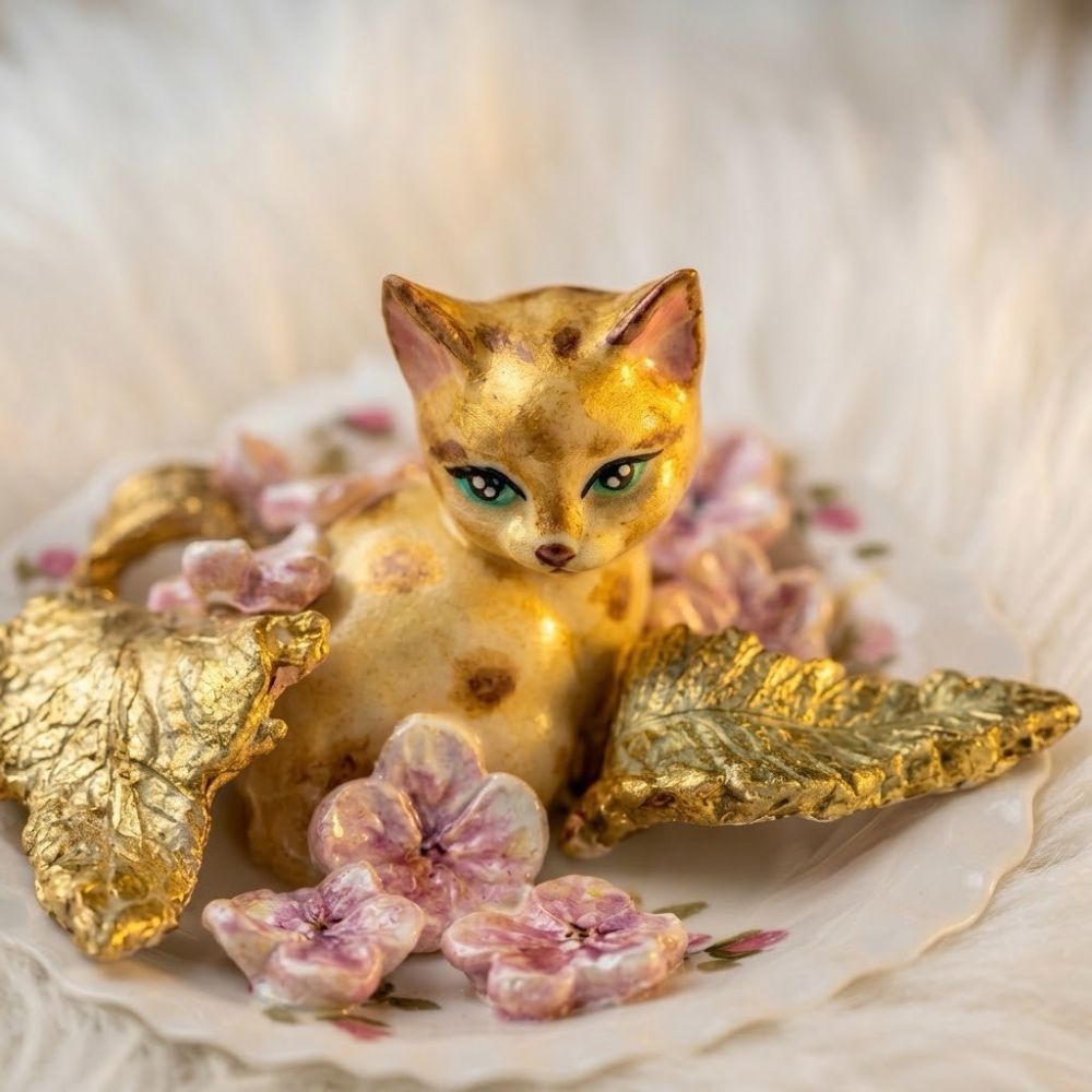 A cat in a flower garden